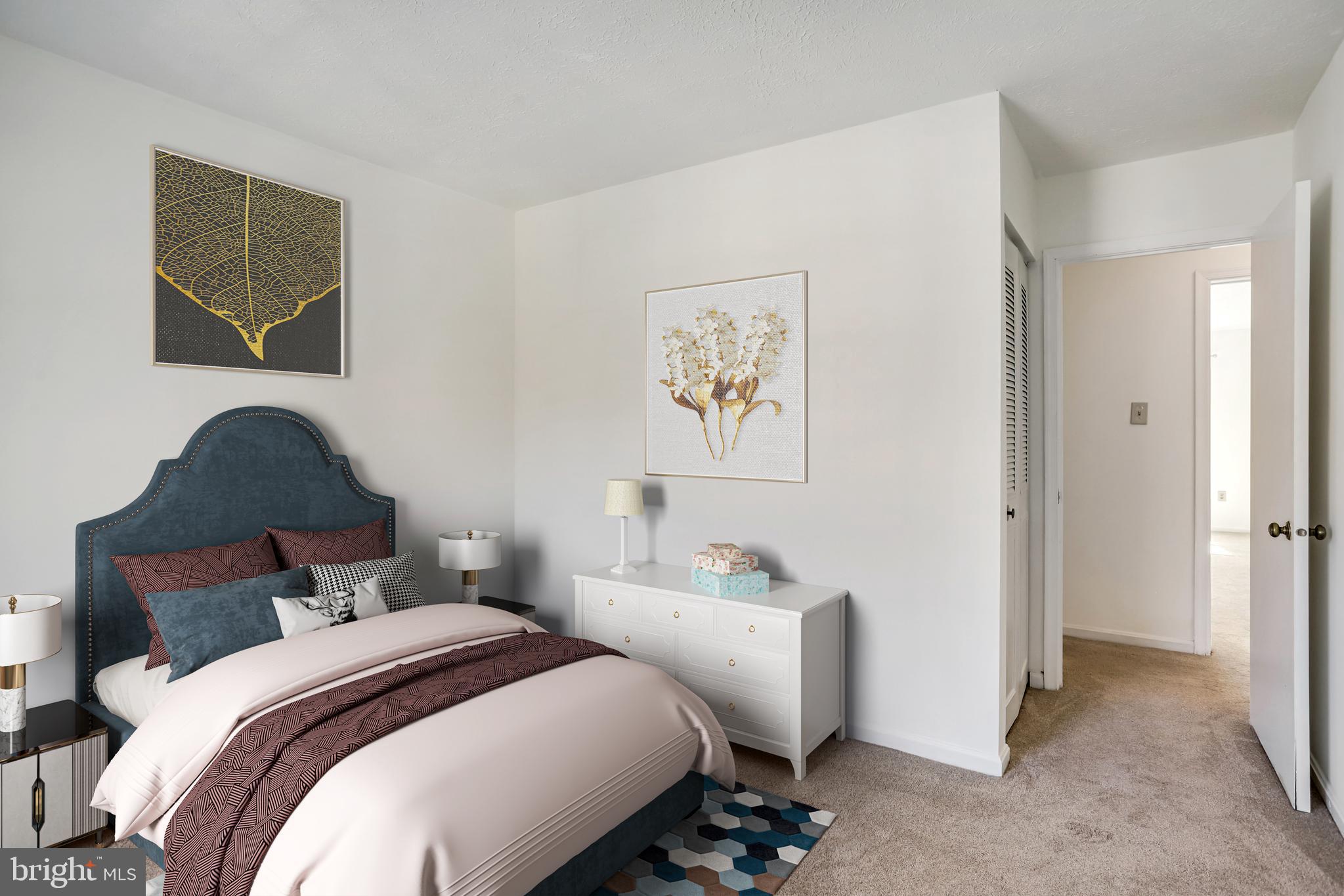 11440 Encore Drive Silver Spring, MD 20901 - Photo 24 of 36 a bedroom with bed and a painting on the wall