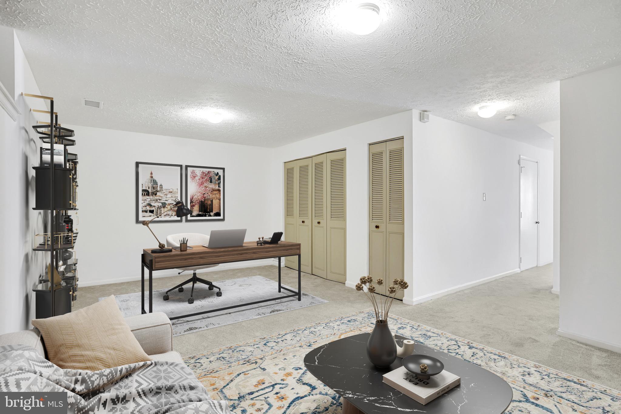 11440 Encore Drive Silver Spring, MD 20901 - Photo 27 of 36 a living room with furniture and a potted plant