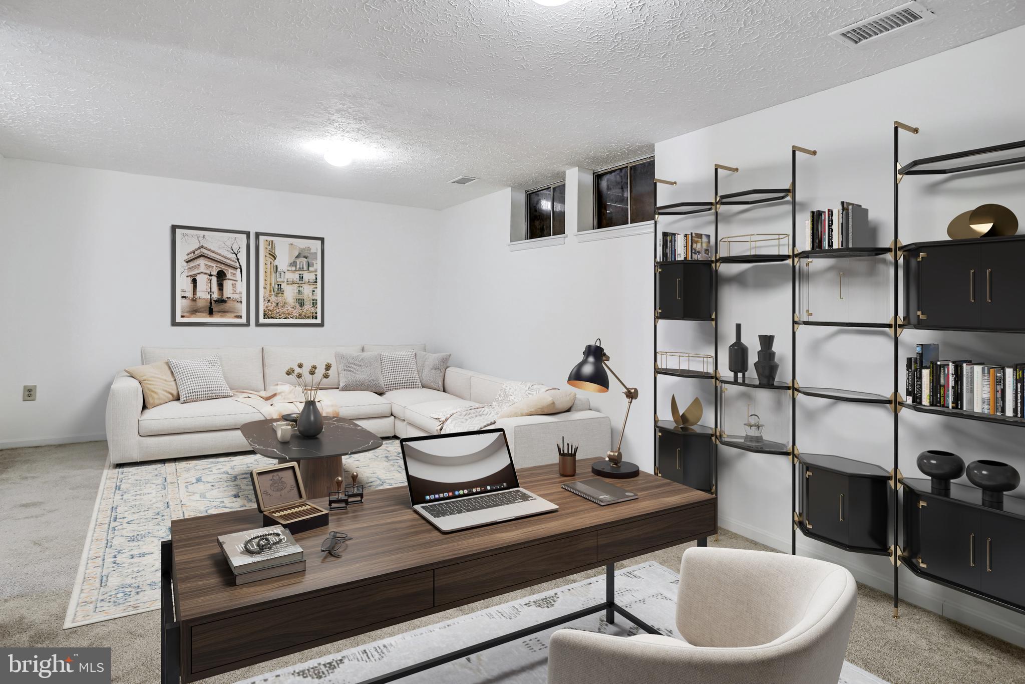 11440 Encore Drive Silver Spring, MD 20901 - Photo 28 of 36 a living room with furniture a rug and white walls