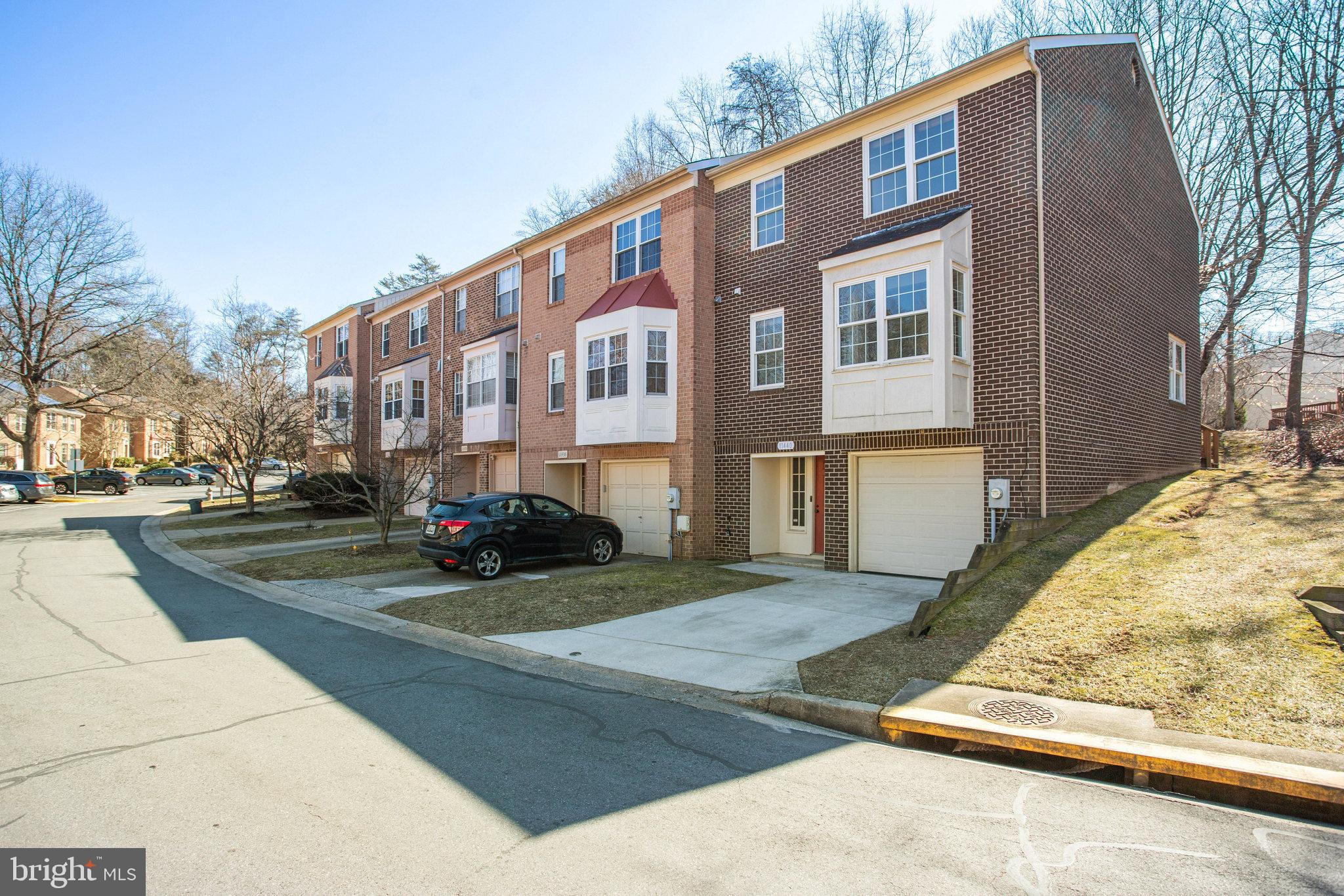 11440 Encore Drive Silver Spring, MD 20901 - Photo 34 of 36 a view of a building with snow on the road
