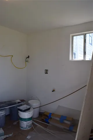 a bathroom with a toilet and a window