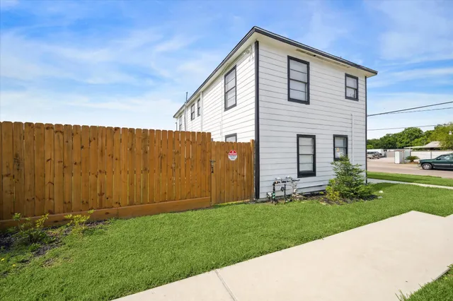 a backyard of a house with lots of green space
