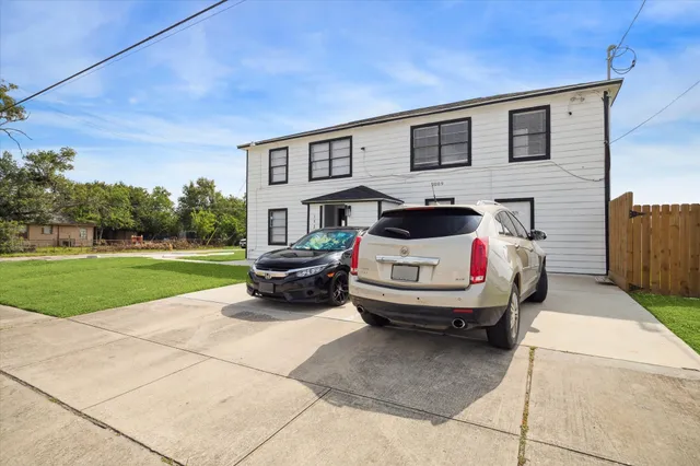a car parked in front of a house