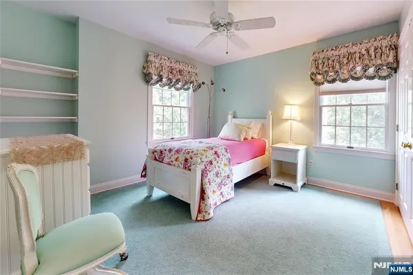 a bed room with a bed and a chair