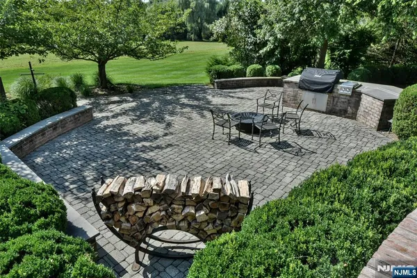 a view of a chair and table in backyard
