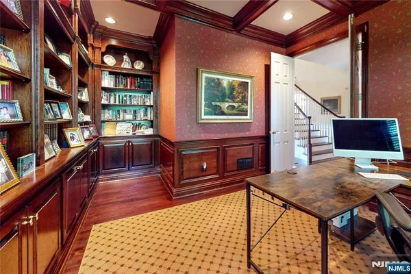 a living room with furniture a rug and a window