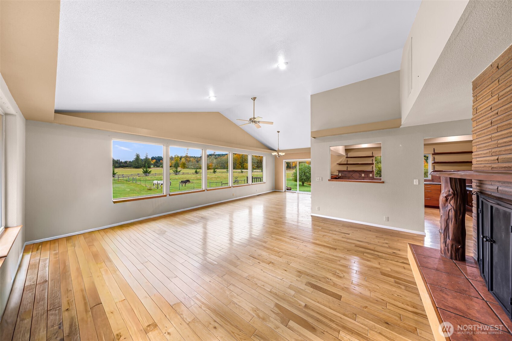 46003 Concrete Sauk Valley Road Concrete, WA 98237 - Photo 13 of 40 a view of an empty room with wooden floor and a window