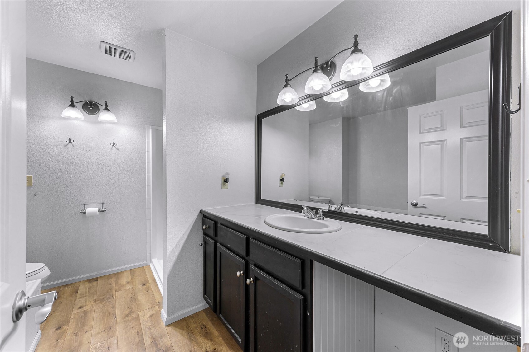 46003 Concrete Sauk Valley Road Concrete, WA 98237 - Photo 16 of 40 a bathroom with a sink vanity and a mirror