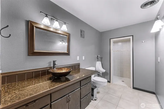 a room with a sink and cabinets