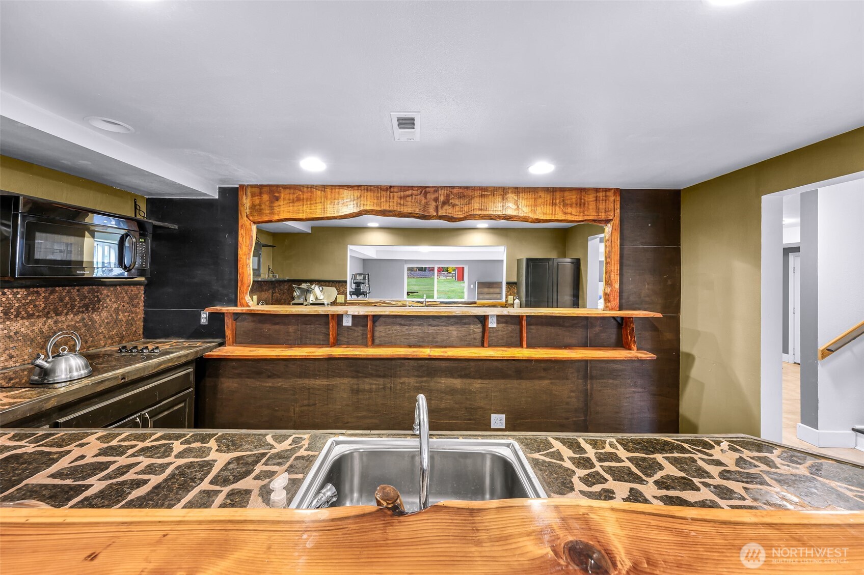 46003 Concrete Sauk Valley Road Concrete, WA 98237 - Photo 27 of 40 a living room with large pool table and a fireplace