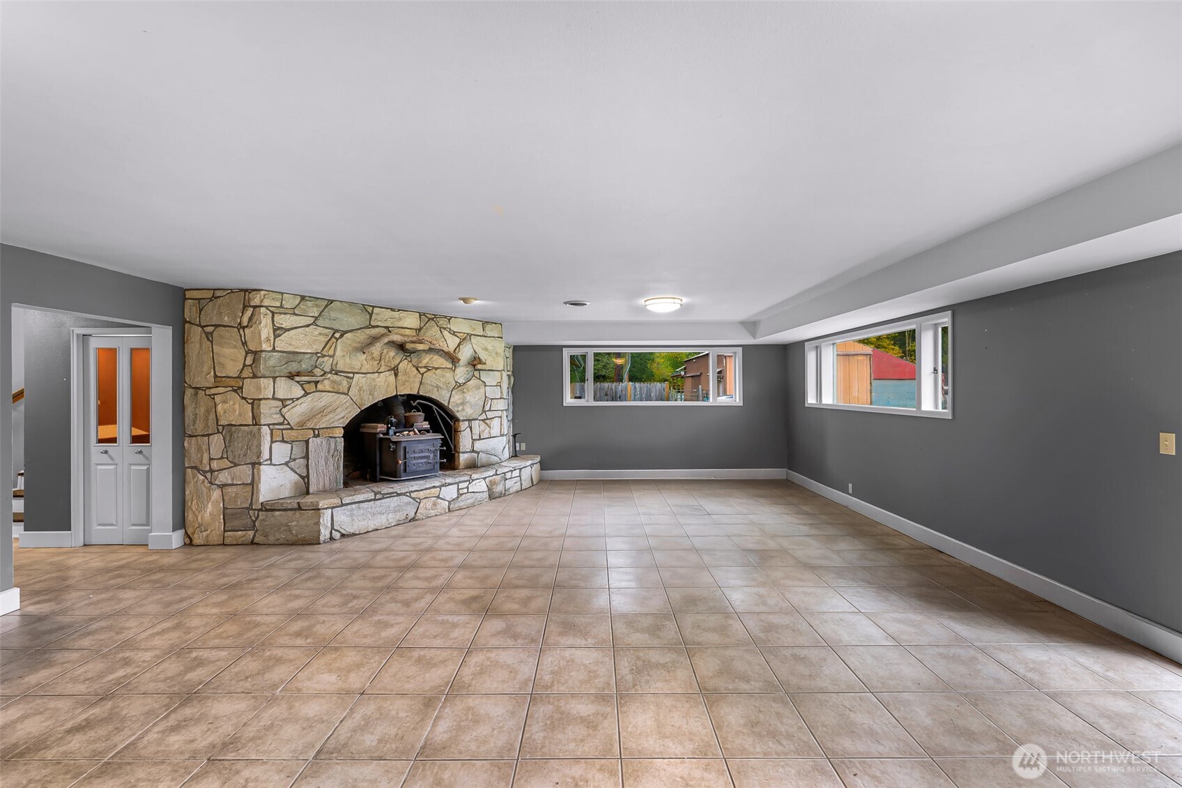 46003 Concrete Sauk Valley Road Concrete, WA 98237 - Photo 30 of 40 a view of an empty room with a fireplace and window