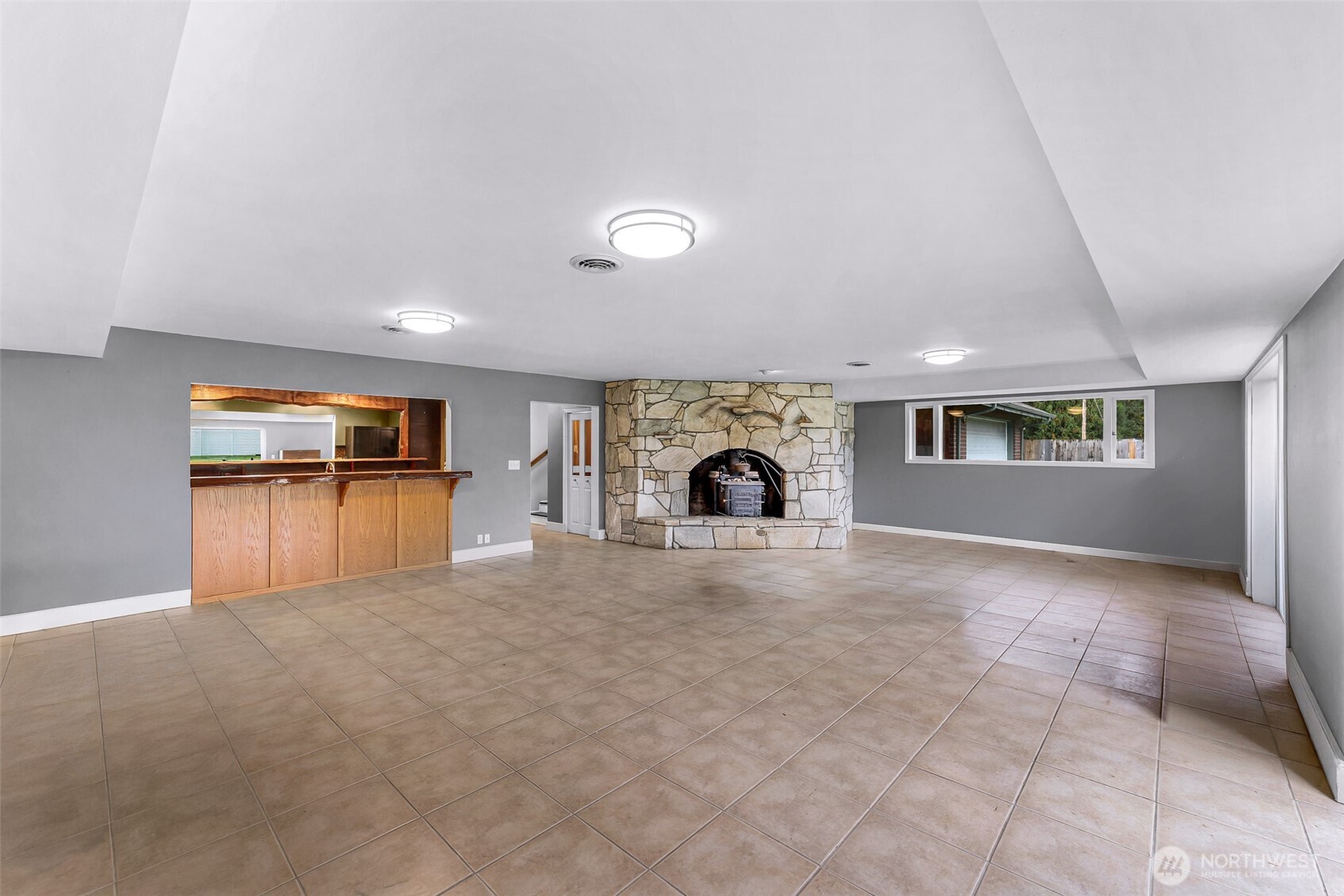 46003 Concrete Sauk Valley Road Concrete, WA 98237 - Photo 31 of 40 an empty room with fireplace and windows