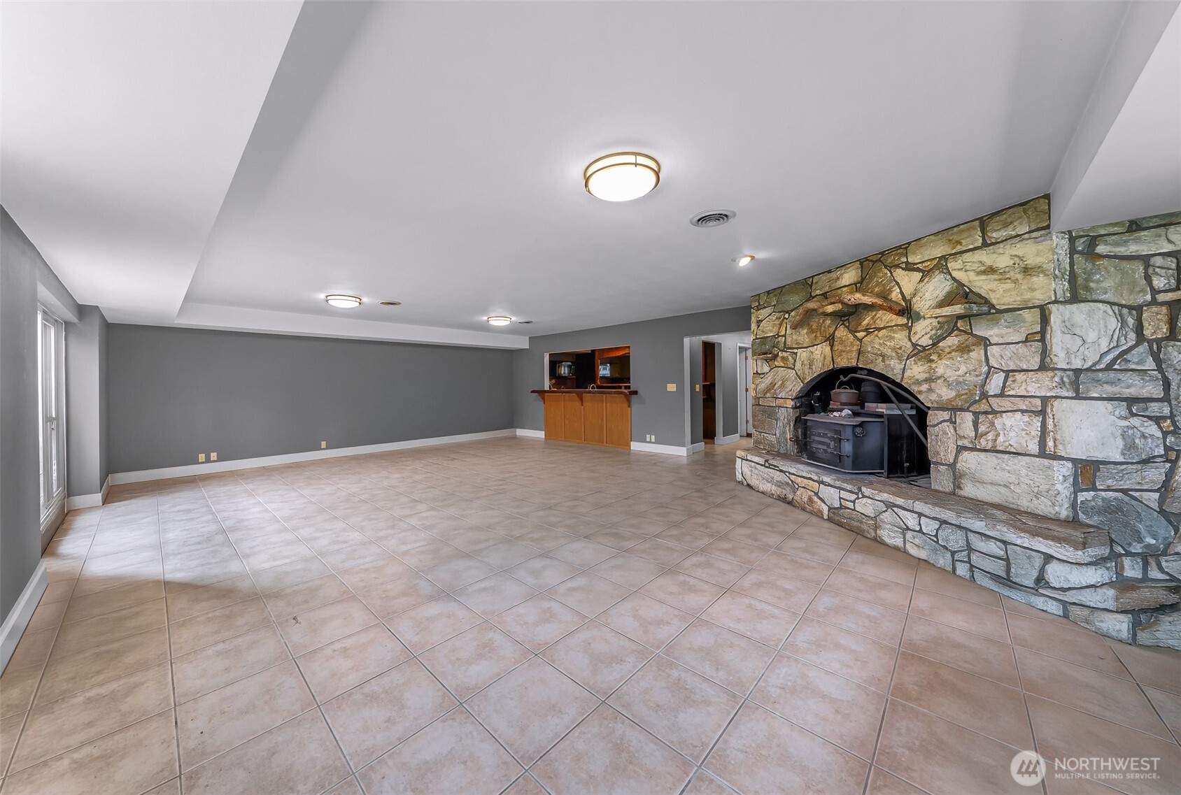46003 Concrete Sauk Valley Road Concrete, WA 98237 - Photo 32 of 40 an empty room with a fireplace and painted walls