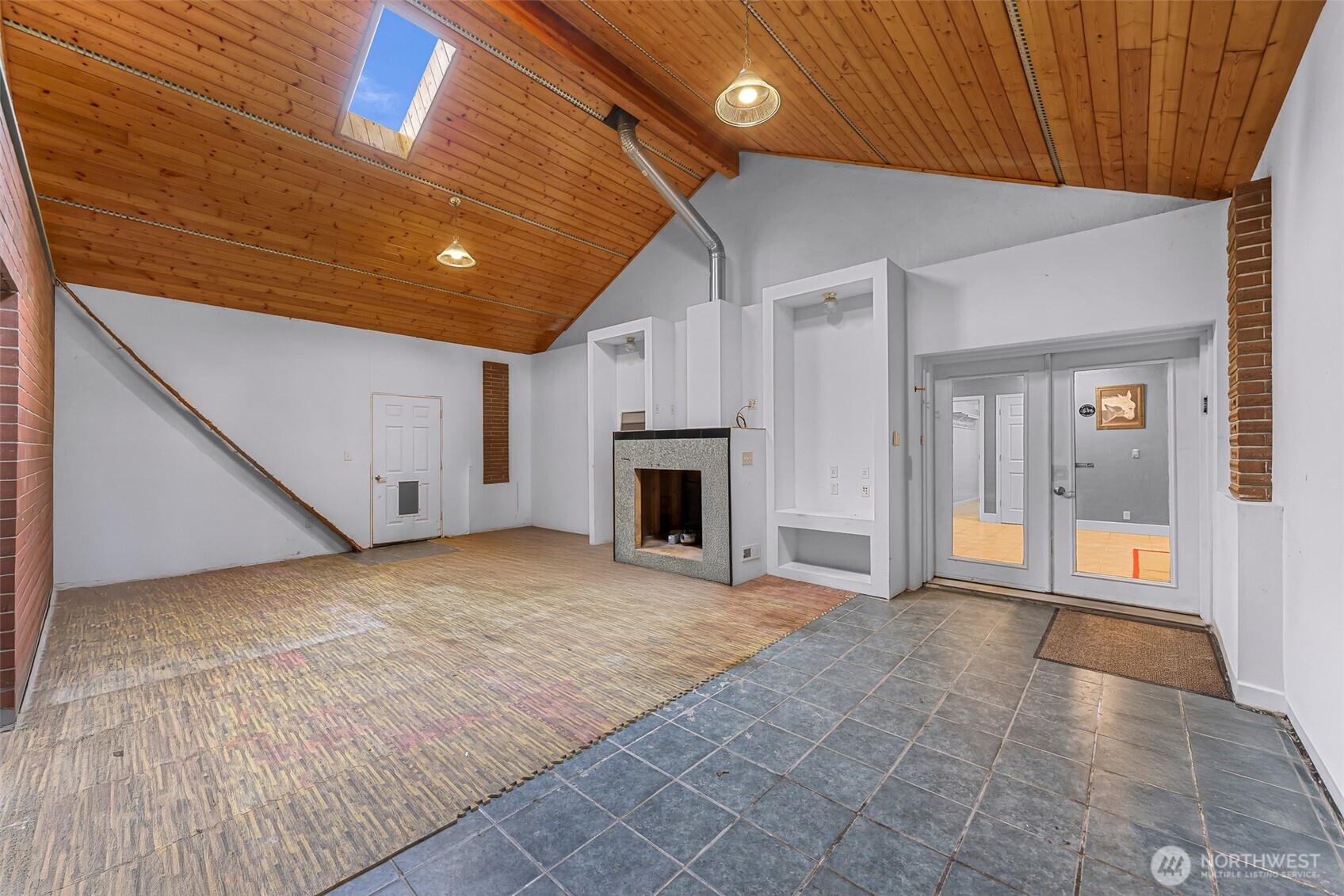 46003 Concrete Sauk Valley Road Concrete, WA 98237 - Photo 33 of 40 a view of an empty room with a fireplace and a window