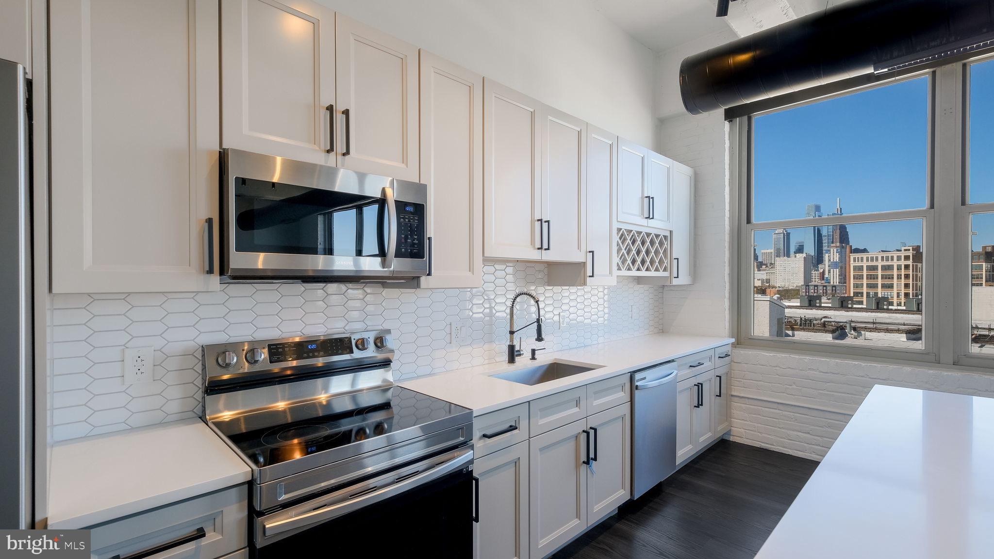 444 North 4th Street, Unit 601 Philadelphia, PA 19123 - Photo 1 of 38 a kitchen with a sink and cabinets
