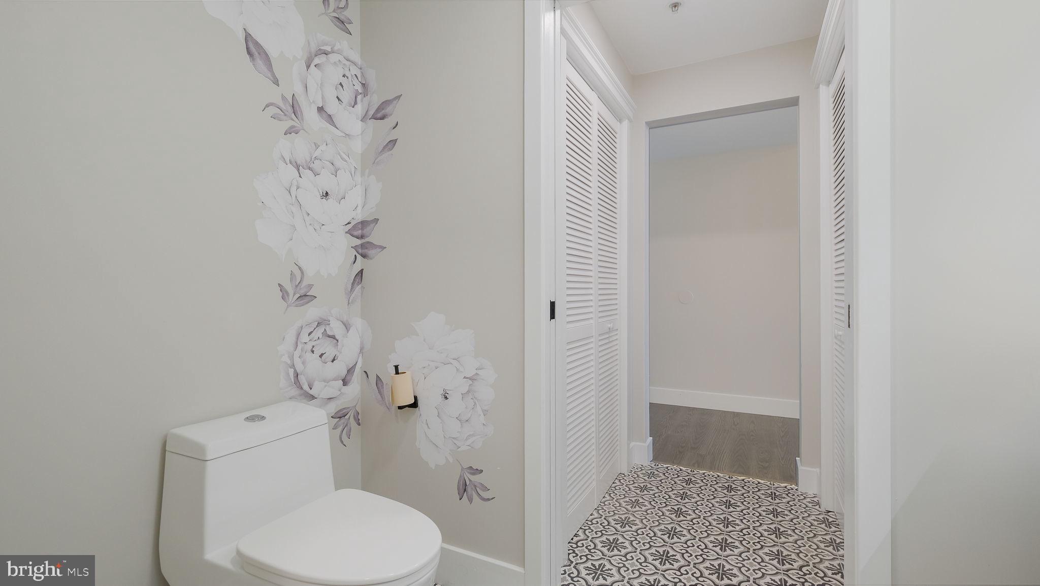 444 North 4th Street, Unit 601 Philadelphia, PA 19123 - Photo 22 of 38 a white toilet sitting next to a shower curtain