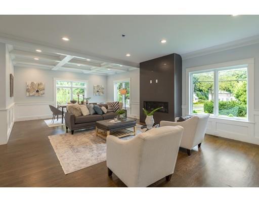 93 Pond Brook Road Newton, MA 02467 - Photo 13 of 33 a living room with furniture and a fireplace