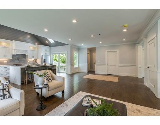 93 Pond Brook Road Newton, MA 02467 - Photo 17 of 33 a living room with stainless steel appliances kitchen island granite countertop furniture and a couch