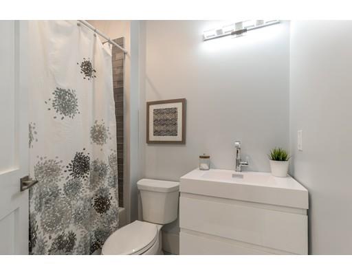 93 Pond Brook Road Newton, MA 02467 - Photo 19 of 33 a bathroom with a sink mirror vanity and toilet