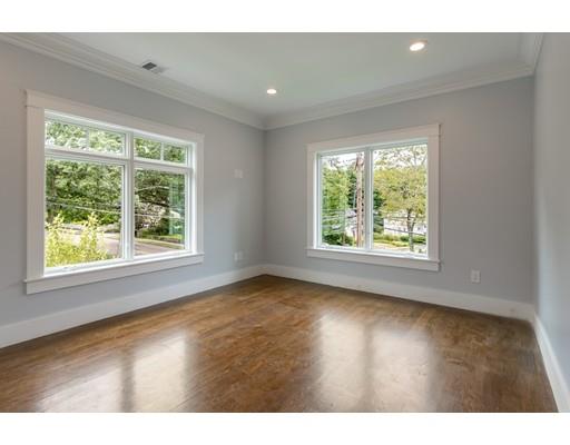93 Pond Brook Road Newton, MA 02467 - Photo 20 of 33 a view of an empty room with wooden floor and a window