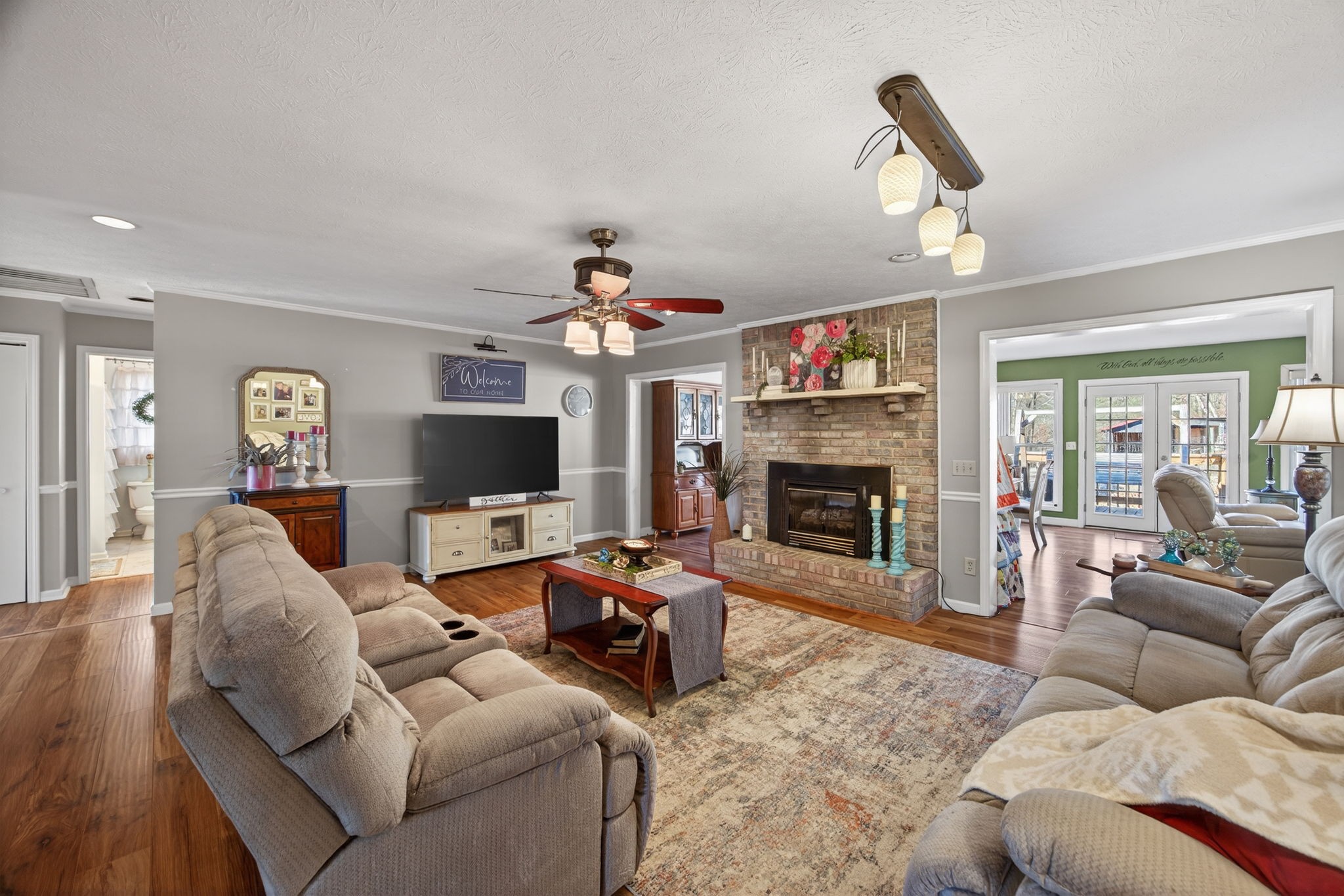 2895 Free State Road Gainesboro, TN 38562 - Photo 15 of 42 a living room with furniture a flat screen tv and a fireplace