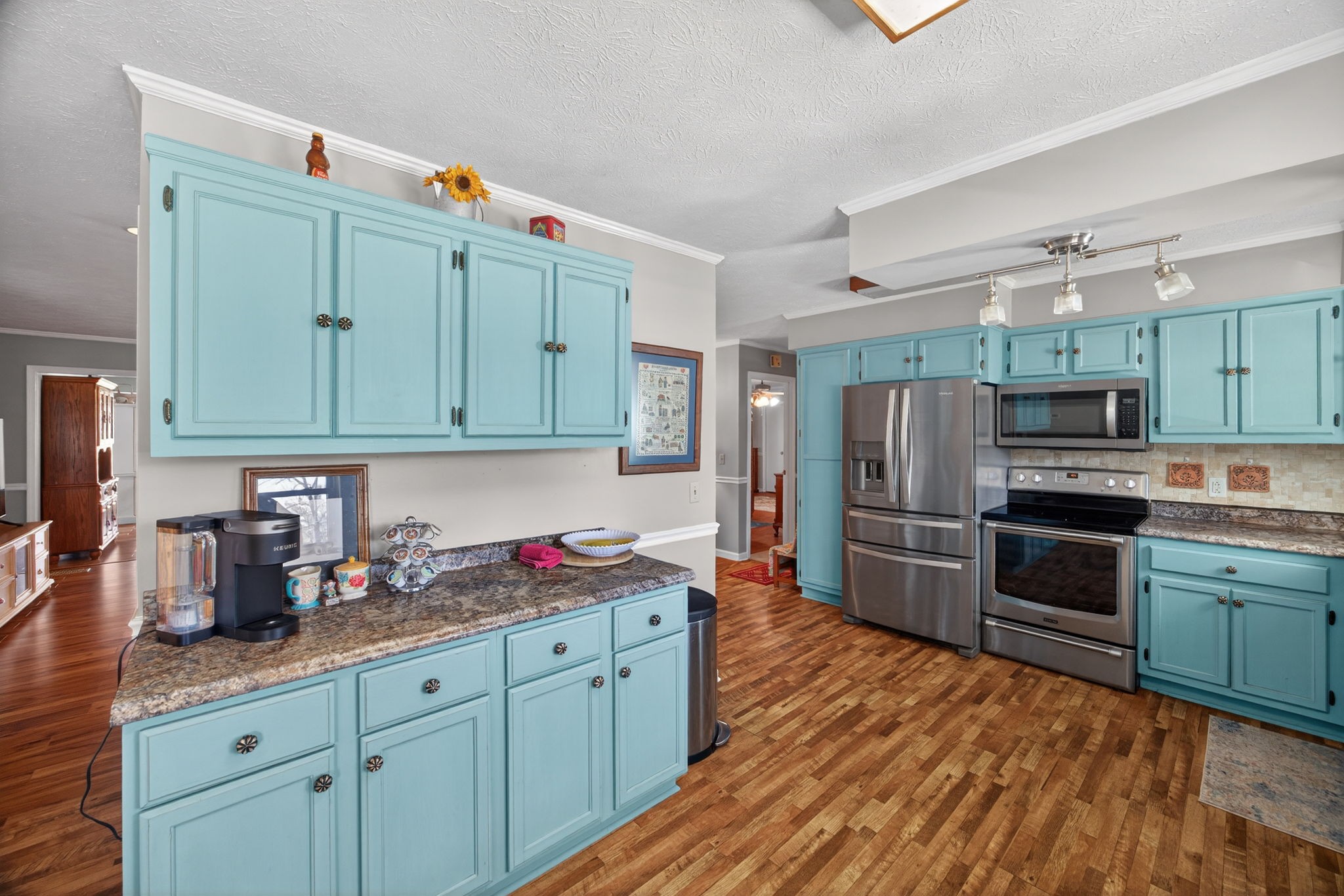 2895 Free State Road Gainesboro, TN 38562 - Photo 18 of 42 a kitchen with granite countertop stainless steel appliances and wooden cabinets