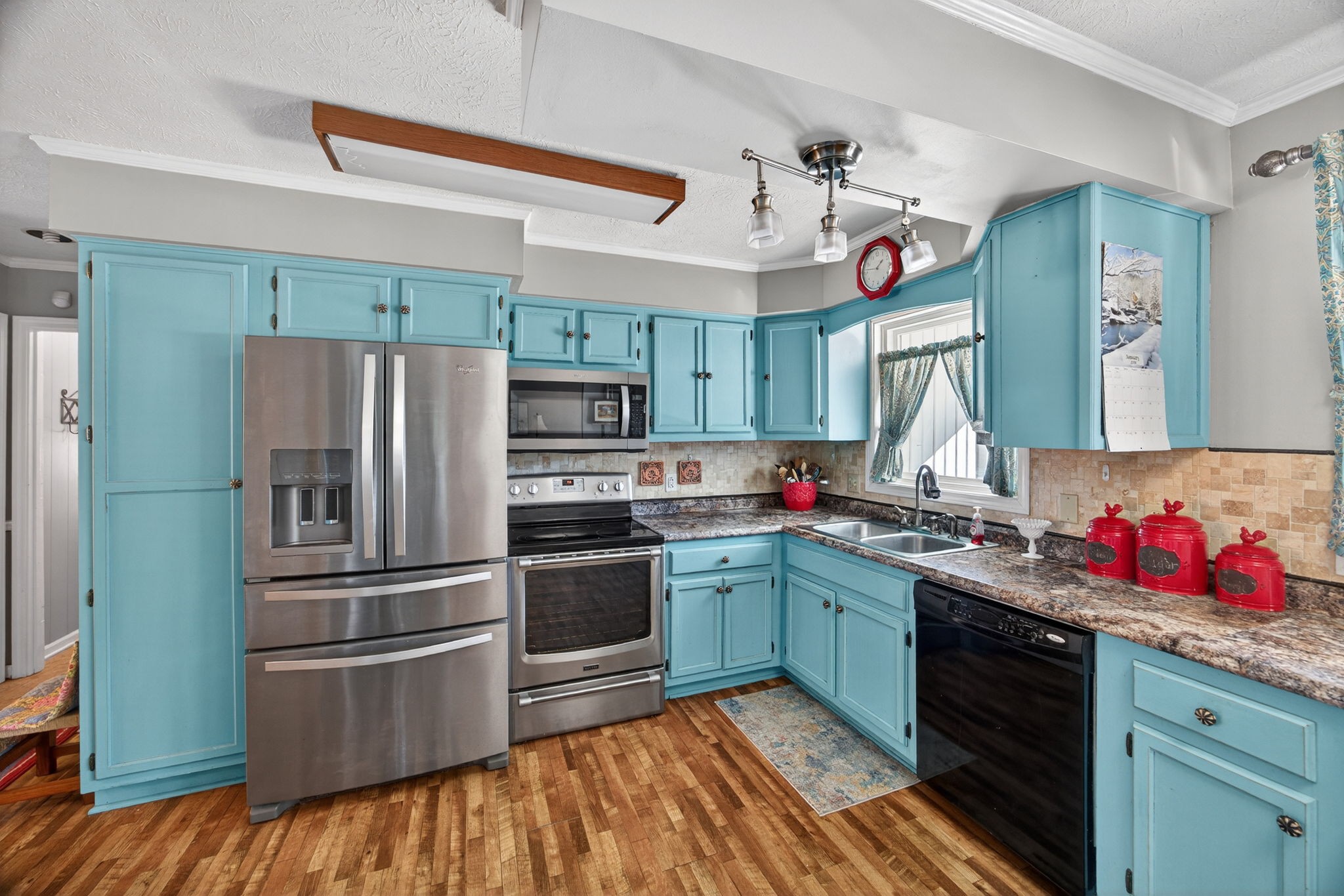 2895 Free State Road Gainesboro, TN 38562 - Photo 19 of 42 a kitchen with granite countertop stainless steel appliances and wooden cabinets