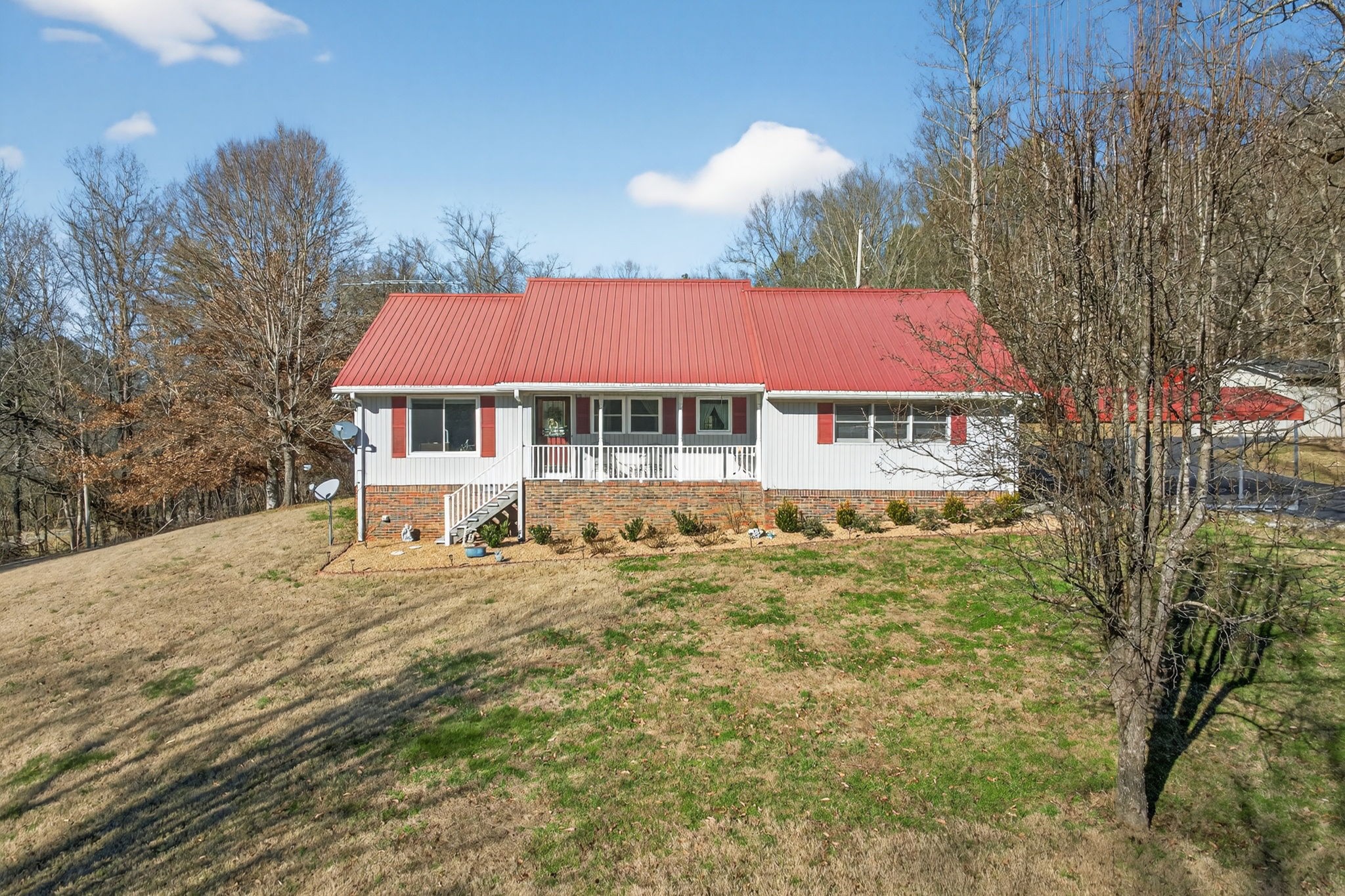 2895 Free State Road Gainesboro, TN 38562 - Photo 2 of 42 a house with swimming pool in front of it