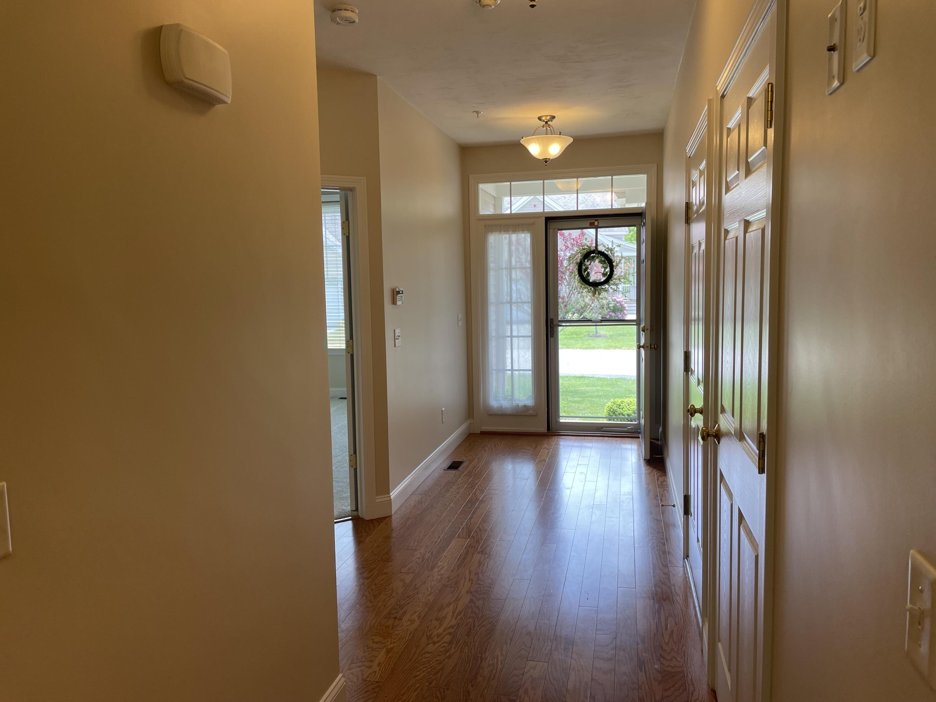 45 Grey Hawk Drive Mashpee, MA 02649 - Photo 3 of 23 a view of a hallway with wooden floor