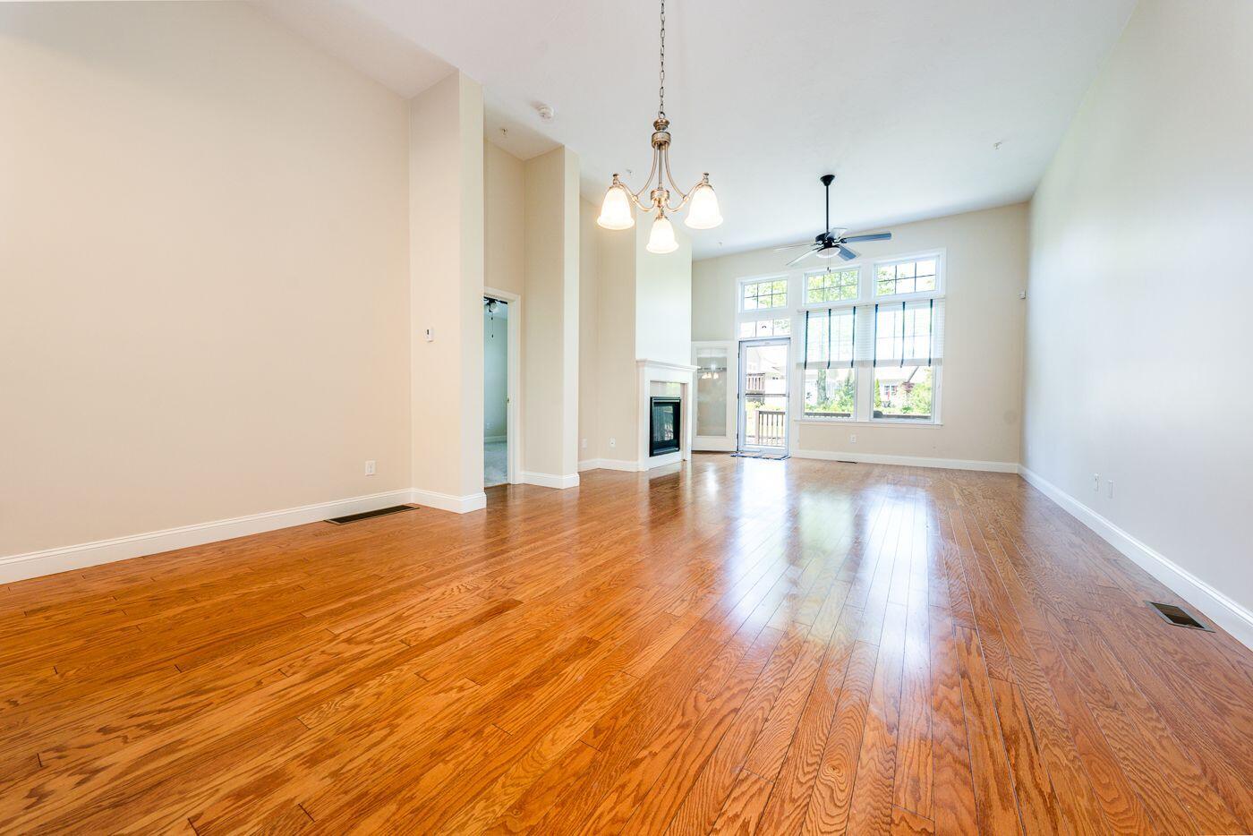 45 Grey Hawk Drive Mashpee, MA 02649 - Photo 4 of 23 a view of an empty room with wooden floor and a window