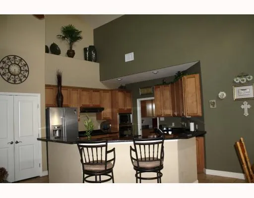 a kitchen with refrigerator and window