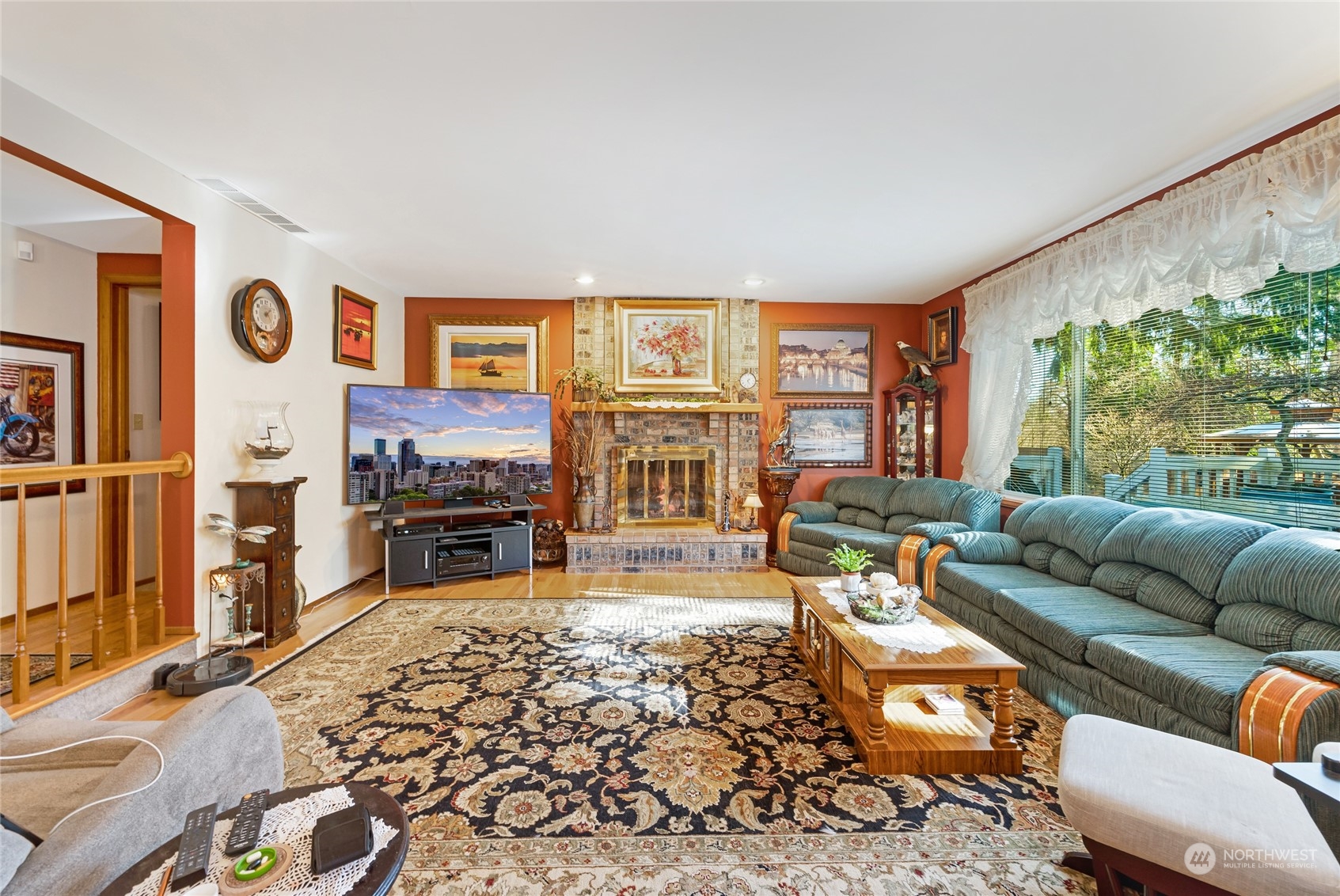 2914 184th Place Southeast Bothell, WA 98012 - Photo 14 of 40 a living room with furniture a fireplace and a flat screen tv