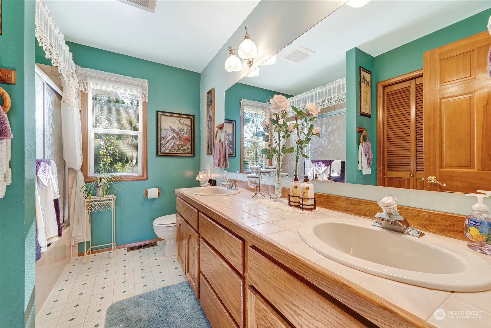 2914 184th Place Southeast Bothell, WA 98012 - Photo 17 of 40 a bathroom with a sink double vanity and a mirror