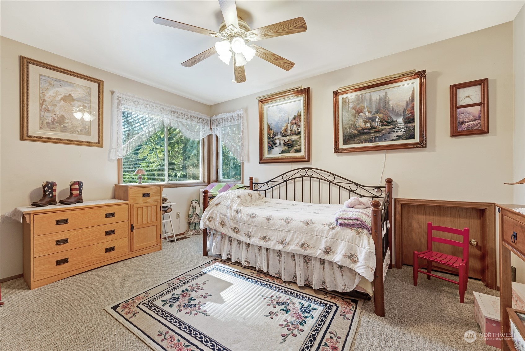2914 184th Place Southeast Bothell, WA 98012 - Photo 18 of 40 a bedroom with a bed and a chandelier