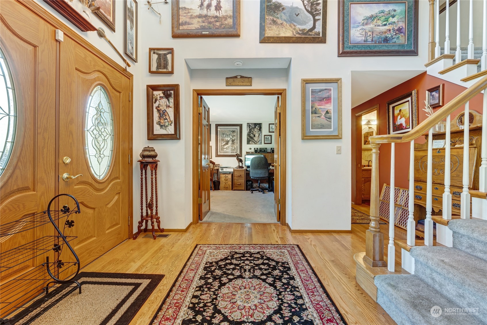 2914 184th Place Southeast Bothell, WA 98012 - Photo 3 of 40 a view of an entryway with wooden floor and a rug