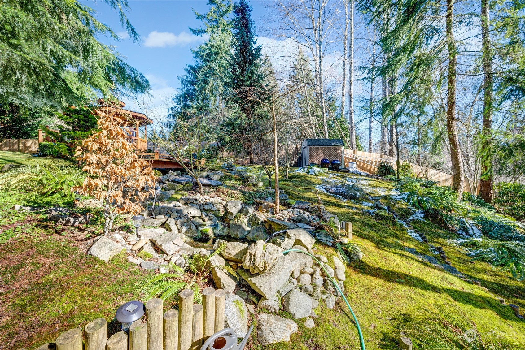 2914 184th Place Southeast Bothell, WA 98012 - Photo 31 of 40 a backyard of a house with table and chairs and wooden fence