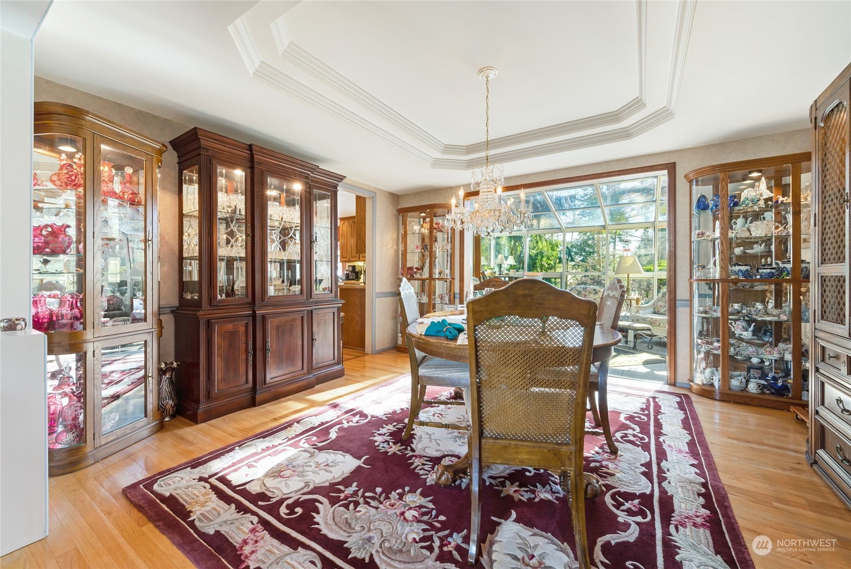 2914 184th Place Southeast Bothell, WA 98012 - Photo 6 of 40 a dining room with furniture a chandelier and wooden floor