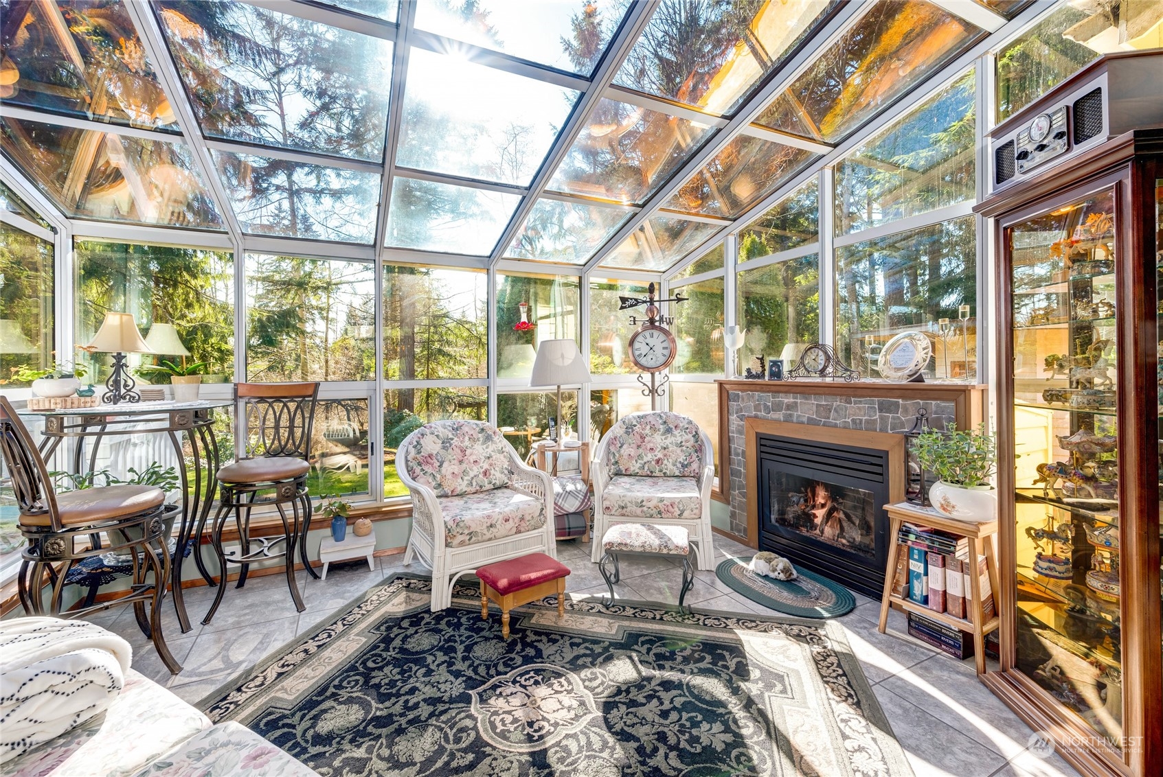 2914 184th Place Southeast Bothell, WA 98012 - Photo 7 of 40 a living room with furniture a fireplace and a floor to ceiling window
