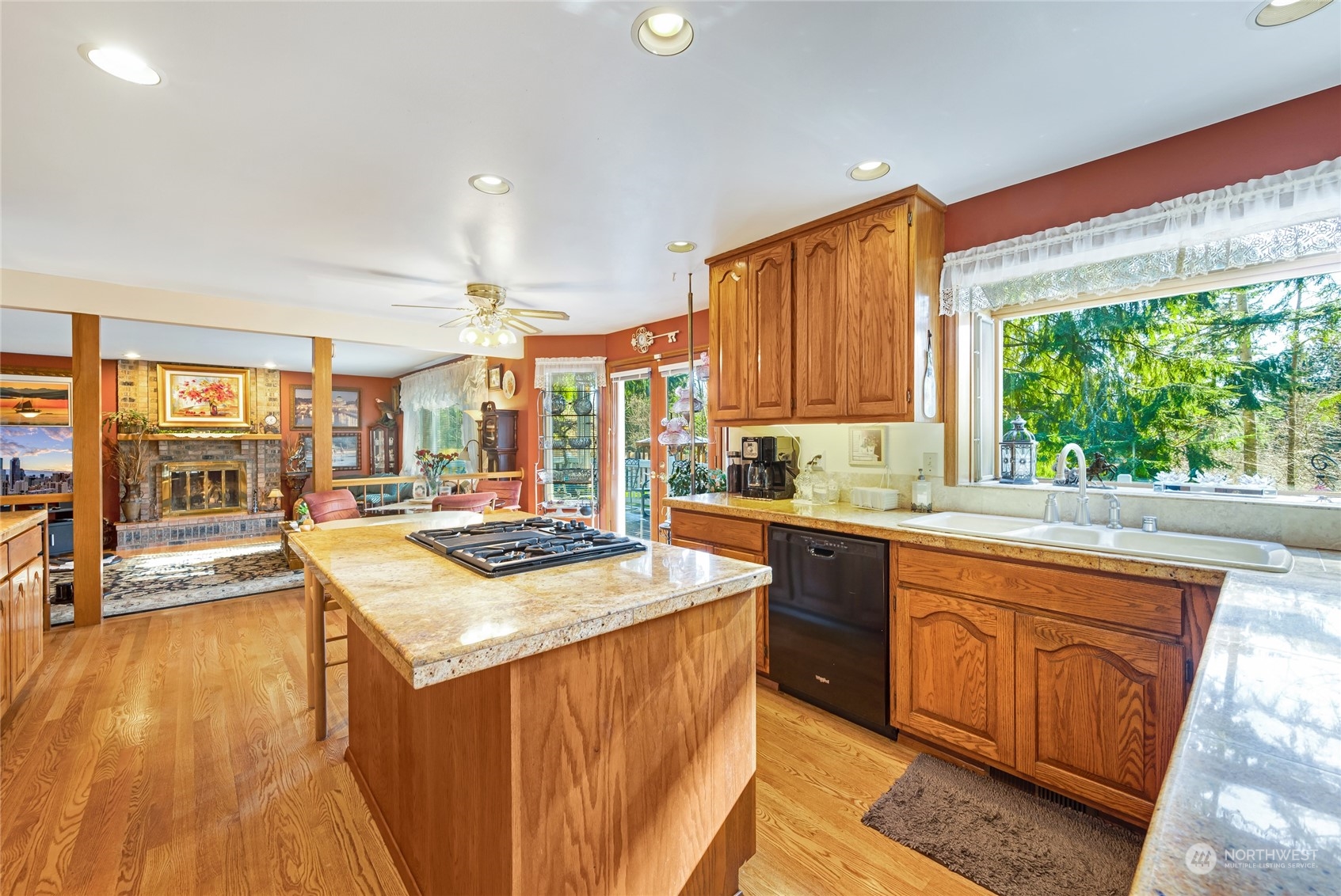2914 184th Place Southeast Bothell, WA 98012 - Photo 9 of 40 a kitchen with stainless steel appliances granite countertop sink stove and wooden cabinets