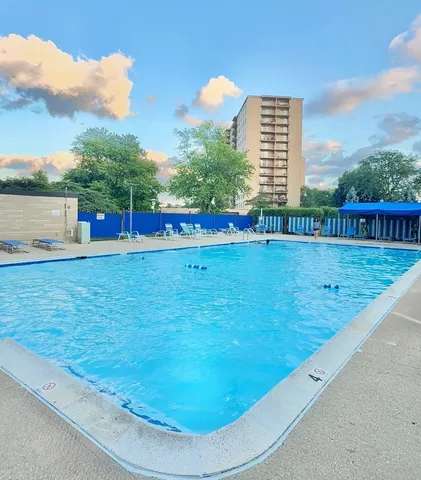 a view of a swimming pool with a terrace