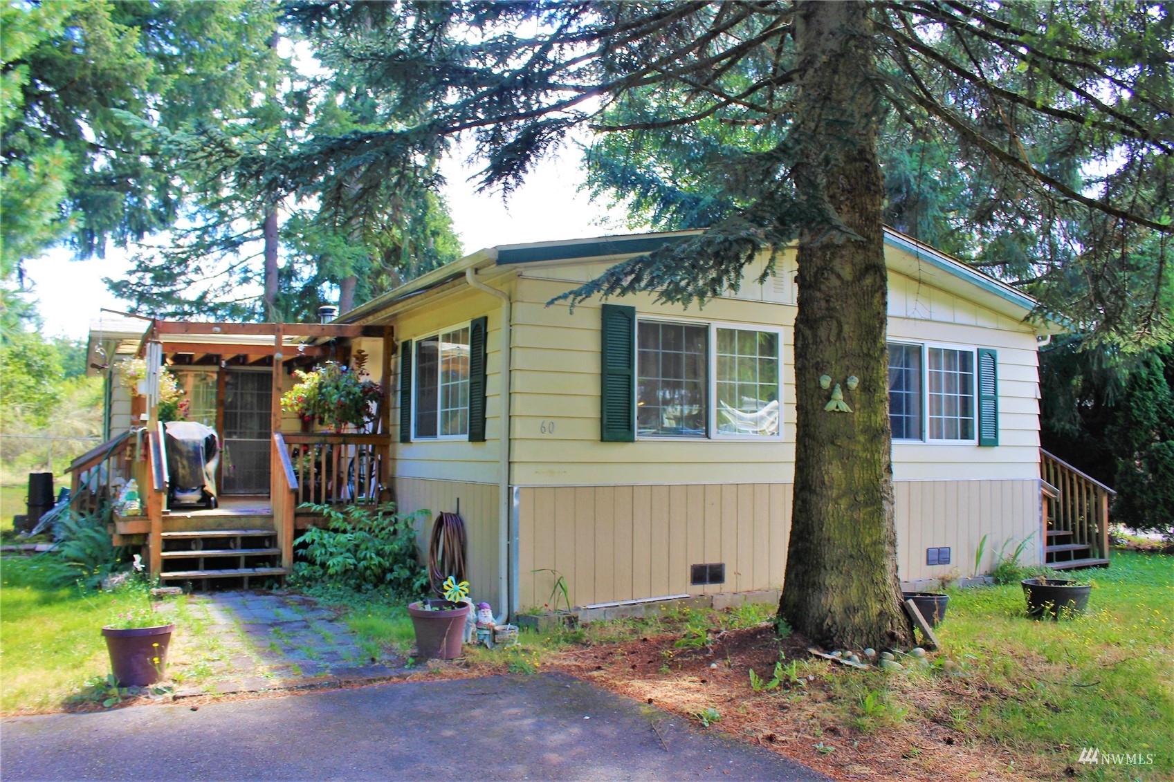 a front view of house with yard and trees
