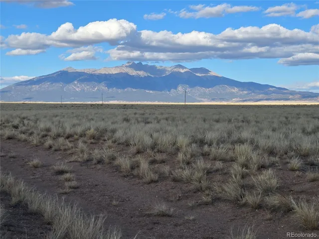 a view of a mountain with sunset view