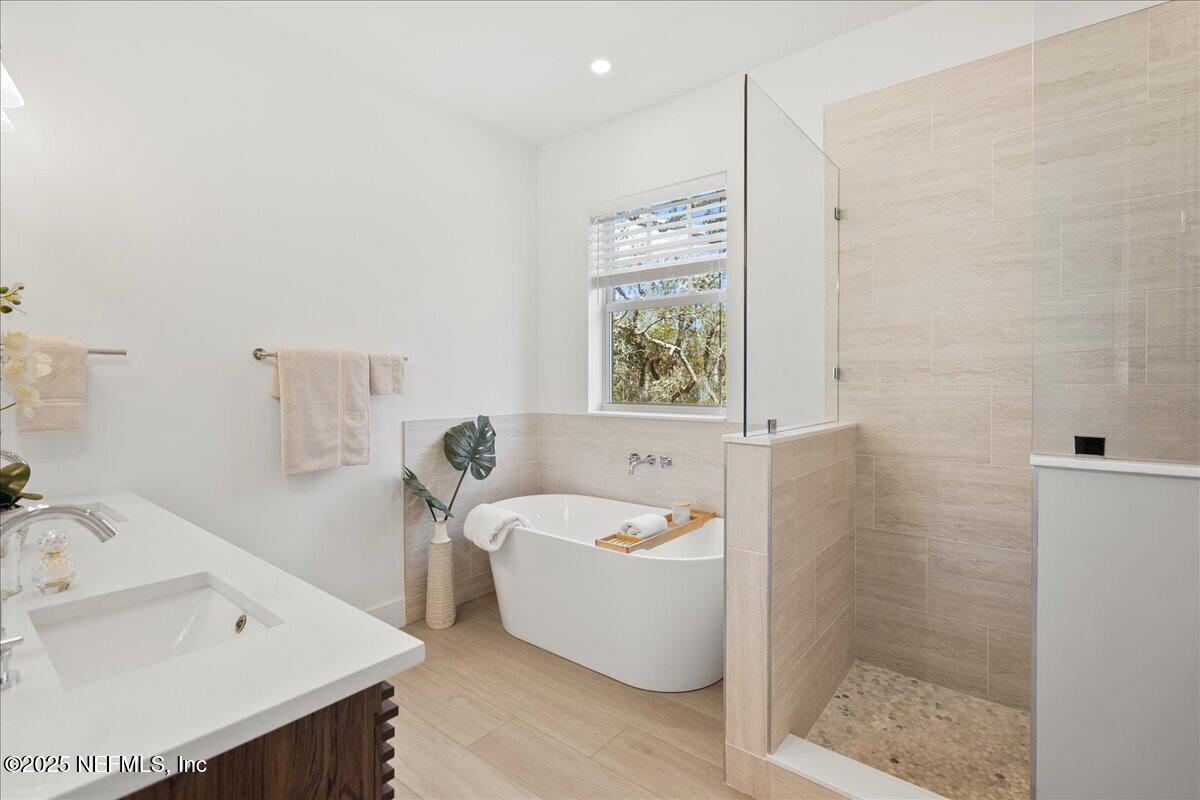 168 Surfside Avenue St. Augustine, FL 32084 - Photo 18 of 28 a spacious bathroom with a bathtub and sink