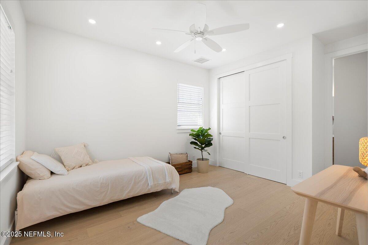 168 Surfside Avenue St. Augustine, FL 32084 - Photo 19 of 28 a living room with furniture and a potted plant