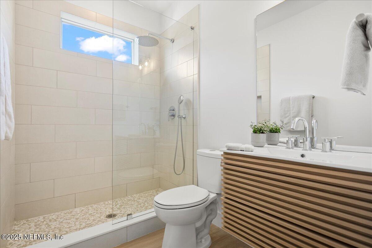 168 Surfside Avenue St. Augustine, FL 32084 - Photo 20 of 28 a bathroom with a sink toilet and shower