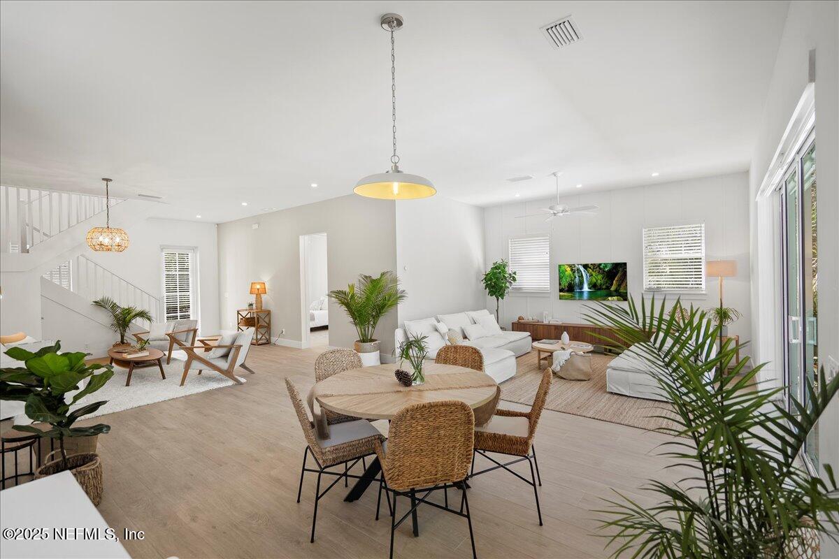 168 Surfside Avenue St. Augustine, FL 32084 - Photo 28 of 28 a view of a dining room with furniture window and wooden floor