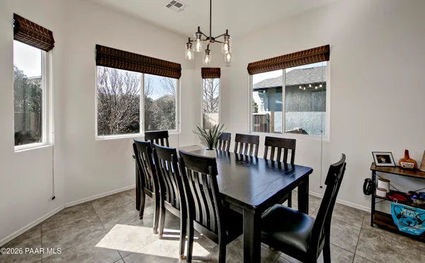 a view of a dining room with furniture window and outside view
