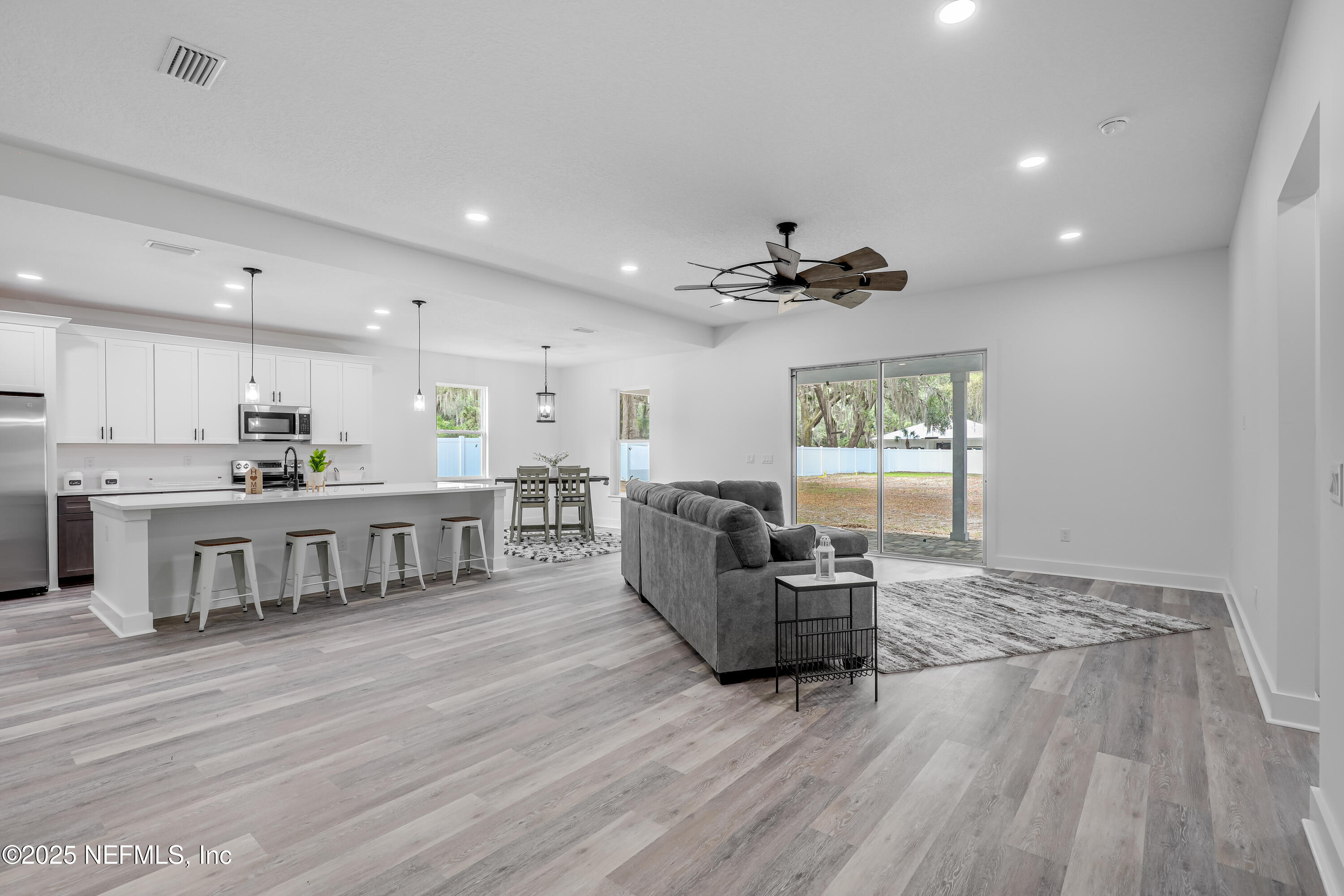 12092 Sheffield Road Jacksonville, FL 32226 - Photo 2 of 55 a living room with furniture and a wooden floor
