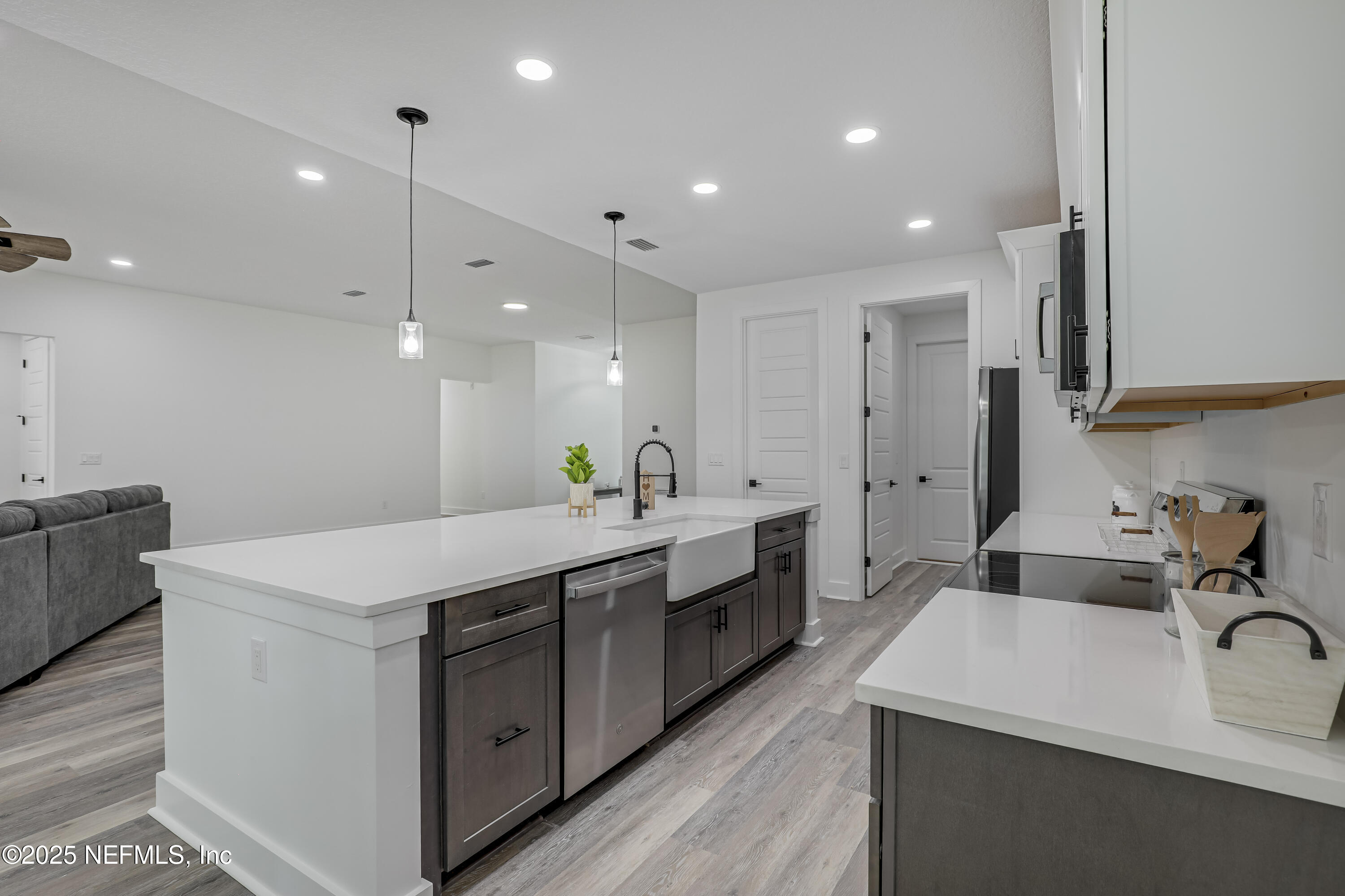 12092 Sheffield Road Jacksonville, FL 32226 - Photo 28 of 55 a kitchen with a sink appliances and cabinets