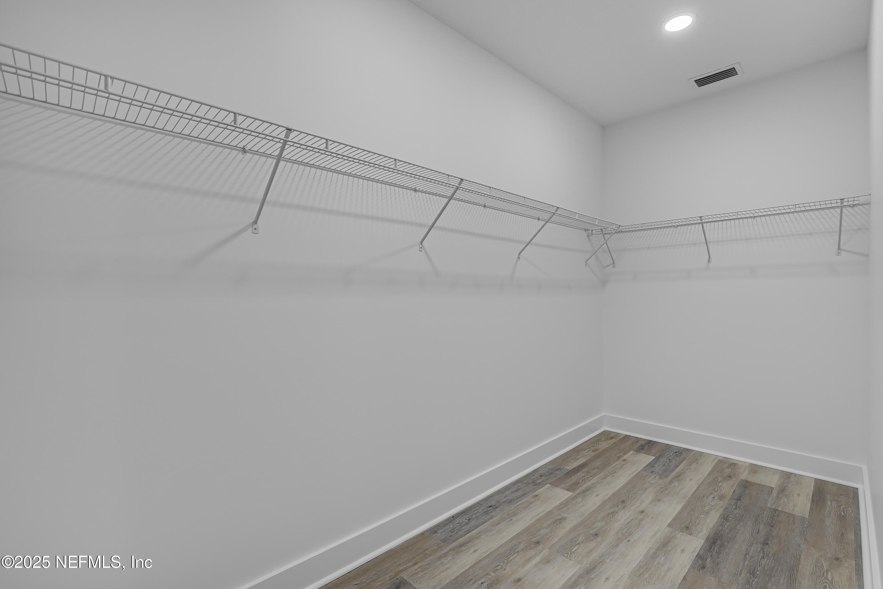 12092 Sheffield Road Jacksonville, FL 32226 - Photo 36 of 55 a view of a room with racks on the wall